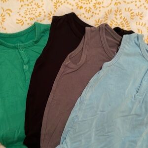 Lot of 4 sleeveless Kyte Baby onesies. All GUC sized 0-3 months.